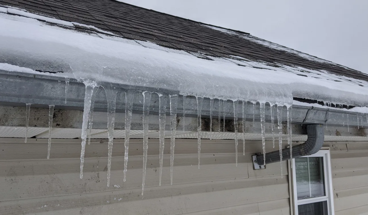 ice forming on gutter line of parma Ohio home