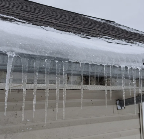 ice forming on gutter line of parma Ohio home